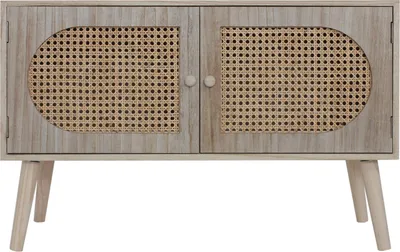 A front view of a boho-style storage bench with two doors featuring woven cane panels and wooden legs.