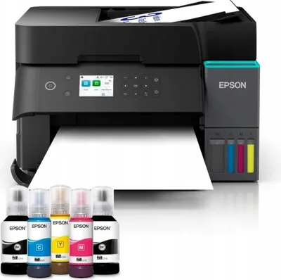A black Epson EcoTank ET-3950 printer with ink bottles in the foreground.
