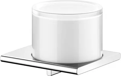 A white soap dispenser with a chrome base on a white background.
