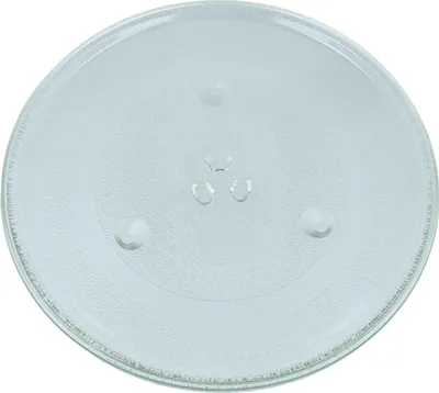 A clear, top-down view of a round glass microwave turntable plate on a white background.