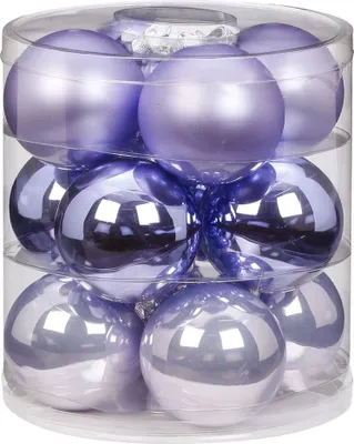 A clear, studio shot of a set of Christmas ornaments in a clear plastic container.