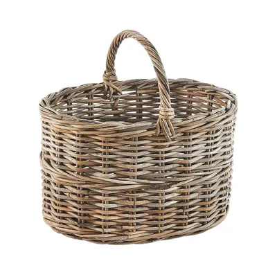 A woven rattan basket with a handle is shown against a white background.