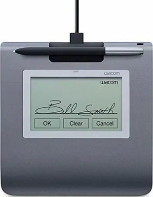 A Wacom signature capture tablet with a stylus resting on top, displaying a signature and buttons on its screen.