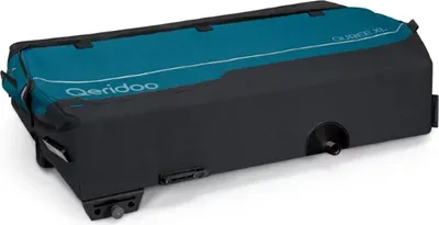 A teal and black cargo trailer is shown from a slightly elevated side angle on a white background.