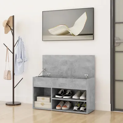 An entryway scene with a shoe bench, coat rack, and artwork on the wall.