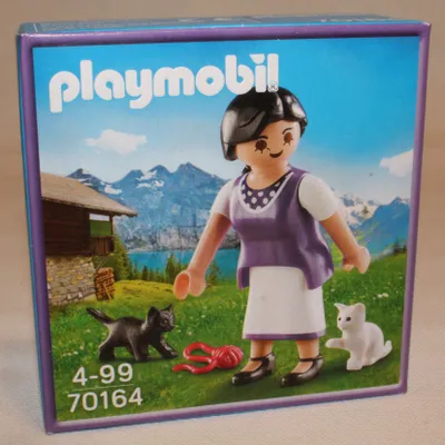 Produktbild von PLAYMOBIL 70164 Sonderfigur Milka Bäuerin mit Kätzchen