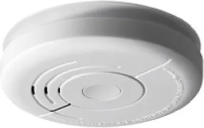 A white smoke detector is shown from a slightly elevated angle against a white background.