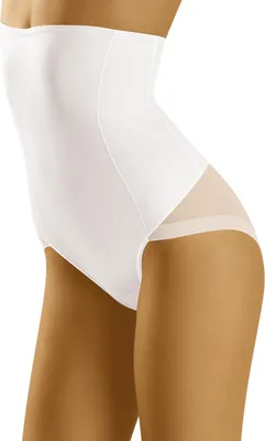 A side profile of a woman wearing white shapewear briefs.