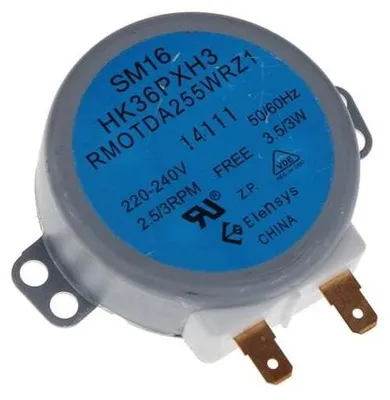 A close-up, slightly angled view of a small electric motor with a blue label displaying technical specifications.