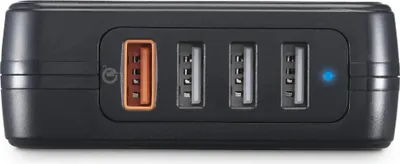 A black USB charging station with four ports, one of which is orange.