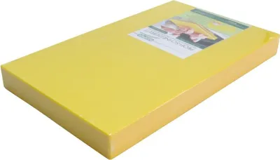 A yellow cutting board is shown on a white background with a label on top.