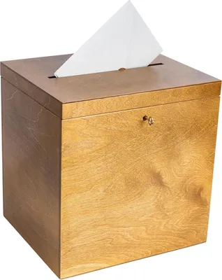 A wooden box with a slot on top and a key lock on the front, with a white envelope sticking out of the slot.