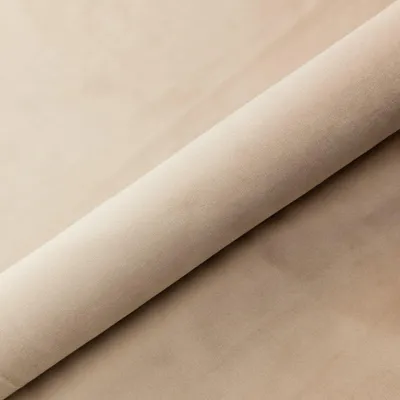 A roll of light beige fabric.