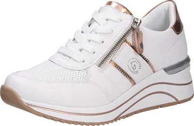 A white sneaker with gold accents and a zipper.