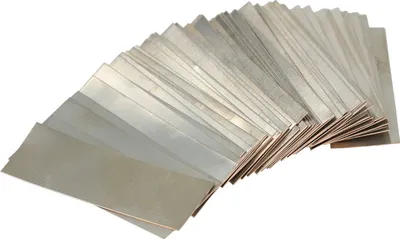 A fan of thin, rectangular metal strips arranged in a fanned-out pattern against a white background.