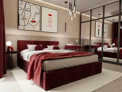 A bedroom with a large bed, artwork on the wall, and mirrored wardrobes.
