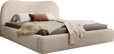 A bed with bedding and pillows, shown against a white background.