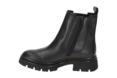 A black leather chelsea boot with a lug sole.