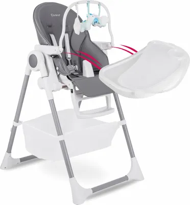 A high-chair for babies, with a tray and a hanging toy.