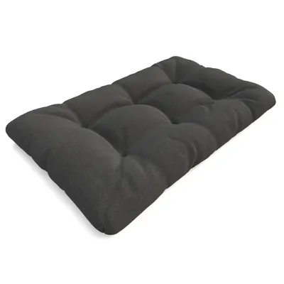 A dark gray tufted cushion on a white background.