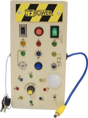 A wooden activity board with various switches, buttons, lights, and a key.