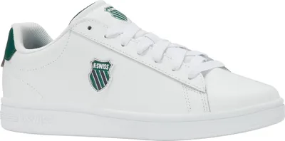 A white K-Swiss sneaker with green accents.