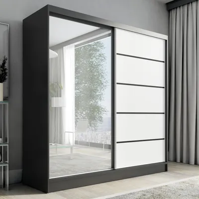 A modern wardrobe with sliding doors, one of which is mirrored.