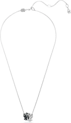 A close-up studio shot of a silver necklace with a swan pendant.