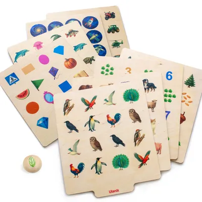 A collection of wooden educational cards for children, featuring various images like animals, shapes, vehicles, and numbers.