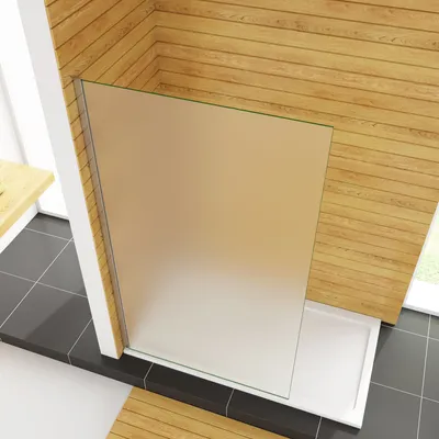 A modern bathroom corner with a walk-in shower enclosure.