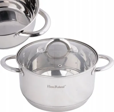 A stainless steel cooking pot with a glass lid is shown against a white background. Another pot is partially visible in the upper left corner.
