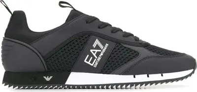A side view of a black EA7 sneaker against a white background.