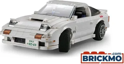 A white Lego-style model of a Mazda FC3S RX-7 car is shown from a front-three-quarter angle against a white background. The car has pop-up headlights and a license plate.