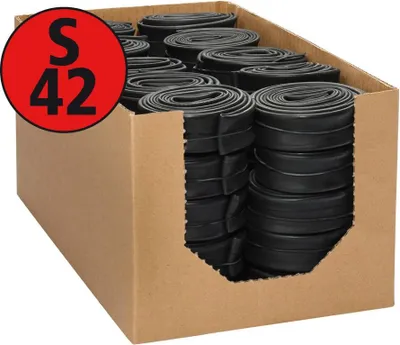 A cardboard box filled with rolled-up black bicycle inner tubes.