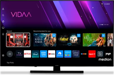 A television screen displaying a smart TV interface with various app icons and recommended content.