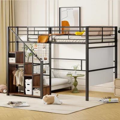 A loft bed with integrated storage and stairs, set up in a bedroom with a sofa and decor.