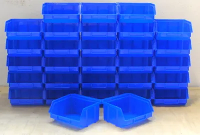A stack of blue plastic storage bins.