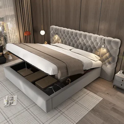 A modern bedroom with a large upholstered bed featuring a tufted headboard and built-in storage.