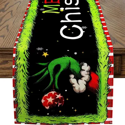 Immagine prodotto di Tovaglia decorativa natalizia, collezione "Grinch", dimensioni 33x173 cm, colore rosso, lavabile, realizzata in poliestere