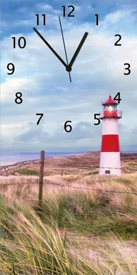 Produktbild von Wallario Design Wanduhr Leuchtturm am Strand von Sylt aus Echtglas, Größe 30 x 60 cm