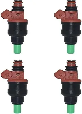 Four identical fuel injectors are arranged in a two-by-two grid against a white background.