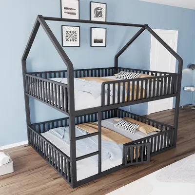 A bunk bed with a house-like frame is shown in a room with blue walls and wooden floors.