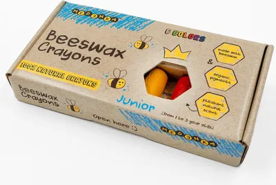 A cardboard box of beeswax crayons for children.