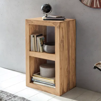 A wooden shelf unit with books and decorative items.