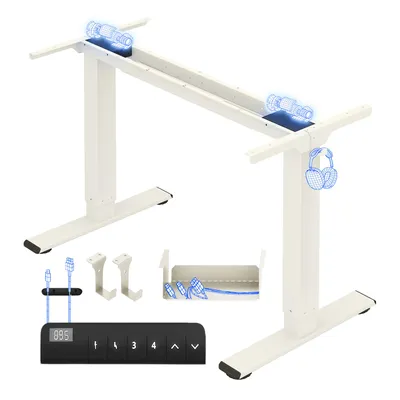A white adjustable standing desk frame with accessories laid out below it.
