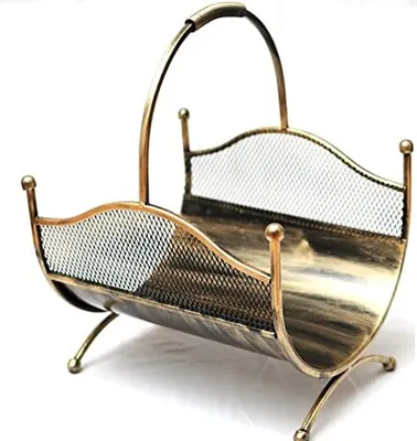 A gold-colored metal firewood basket with a mesh design, shown against a white background.