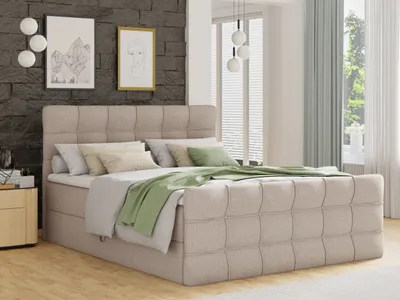 A bedroom scene with a beige boxspring bed as the main focus.