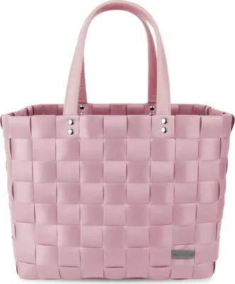 A pink woven shopping basket with pink handles against a white background.