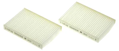 Two white cabin air filters are shown diagonally on a white background.