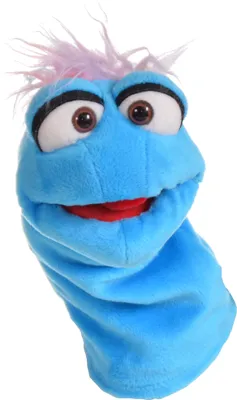 A close-up studio shot of a blue sock puppet with pink fuzzy hair, large brown eyes, and a red mouth.